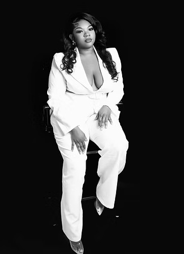 Editorial portrait in a white suit